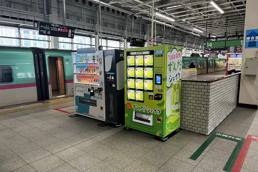 Vending machines on the Shinkansen platform at Sendai Station, allowing passengers to buy drinks before boarding.