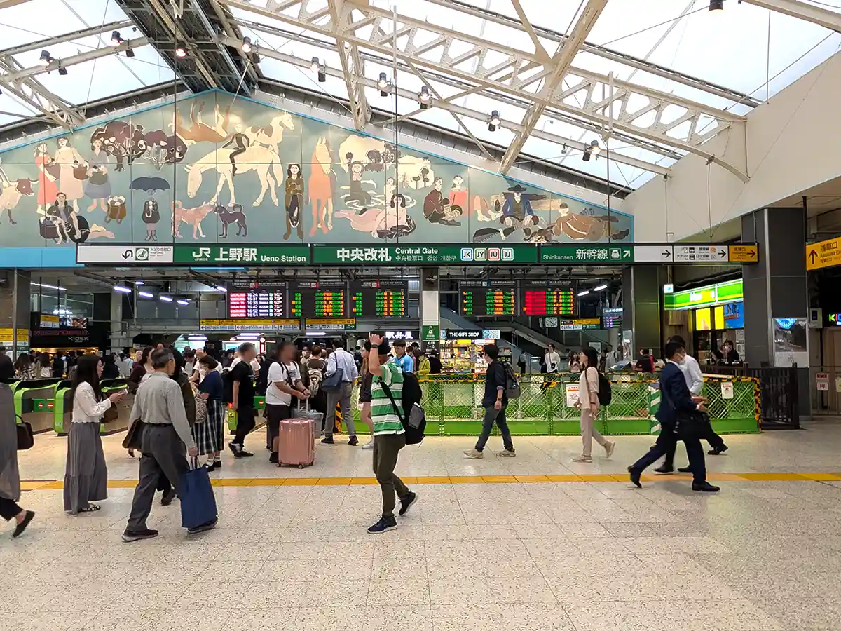 JR Ueno Station Central Gate with ticket gates, departure boards, and travelers in the concourse