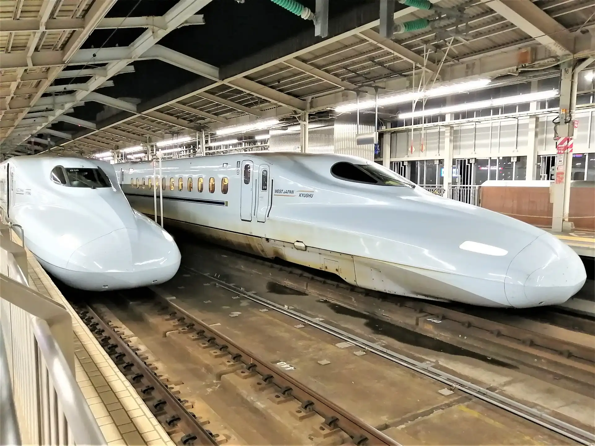 Two Shinkansen Sakura trains stopped at Hiroshima Station platform