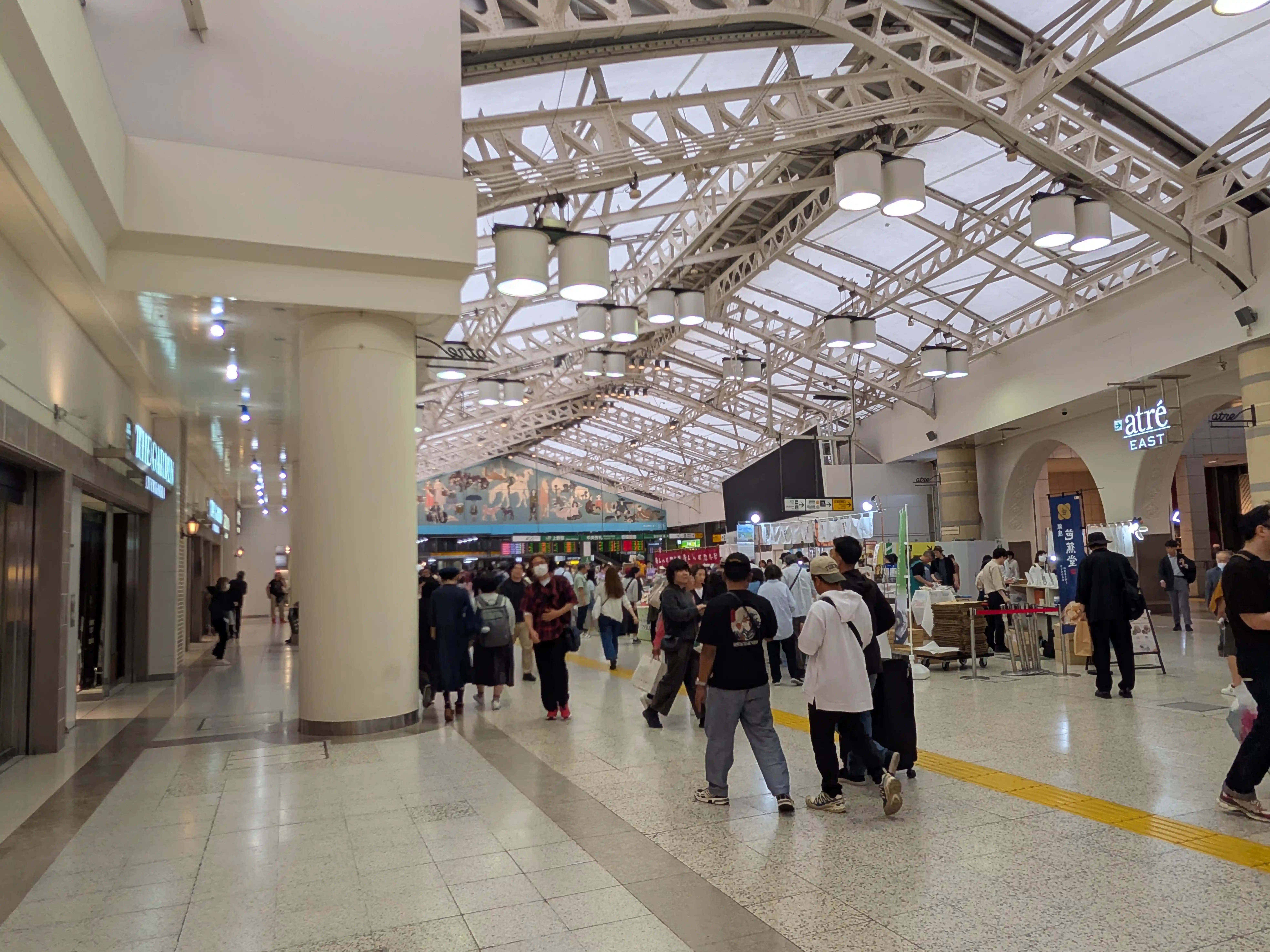 JR Ueno Station concourse near Hirokoji Exit with shops, travelers, and Atre East signs