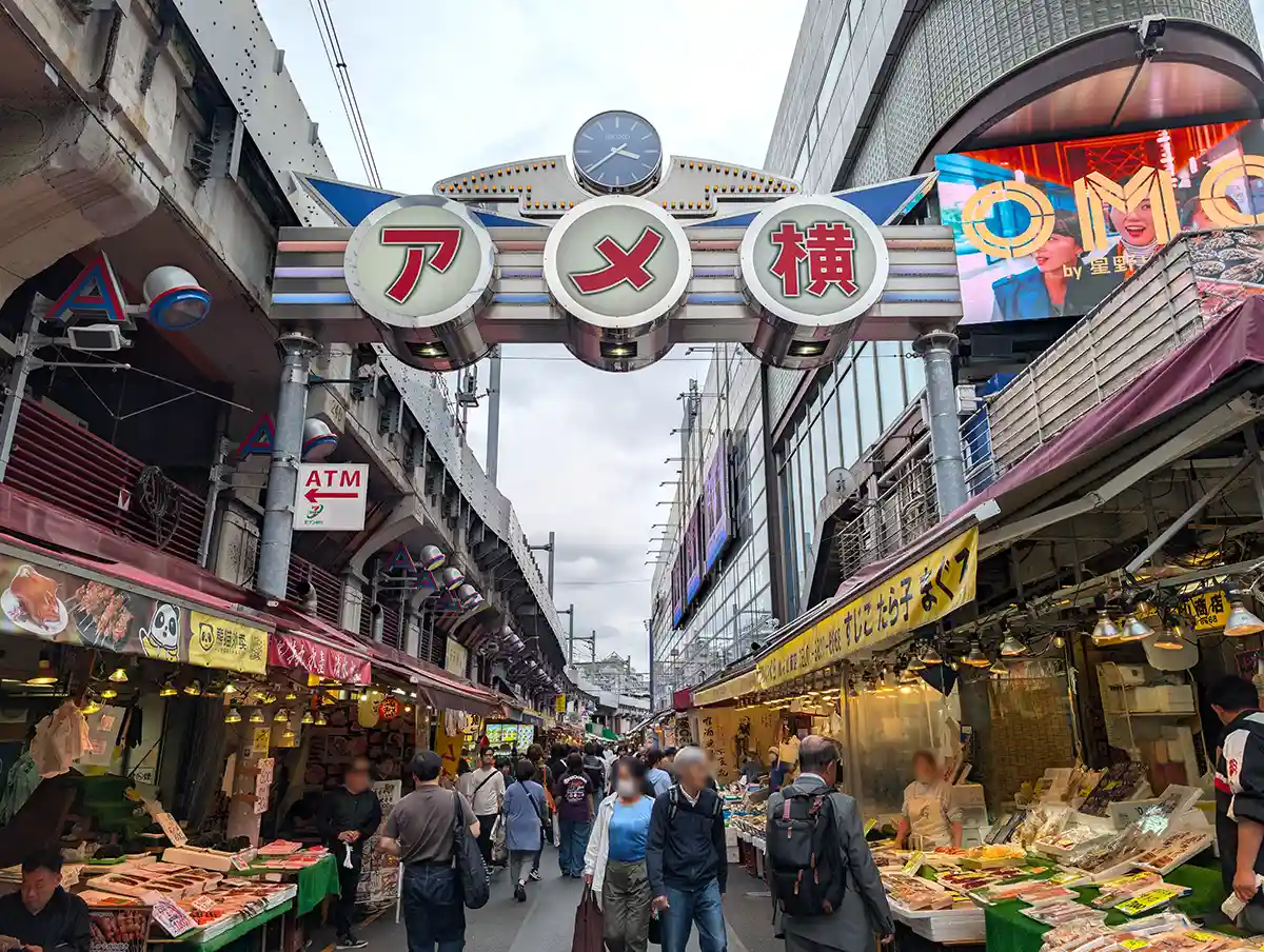 Ameyoko market near Ueno Station with crowded shopping street and outdoor food stalls