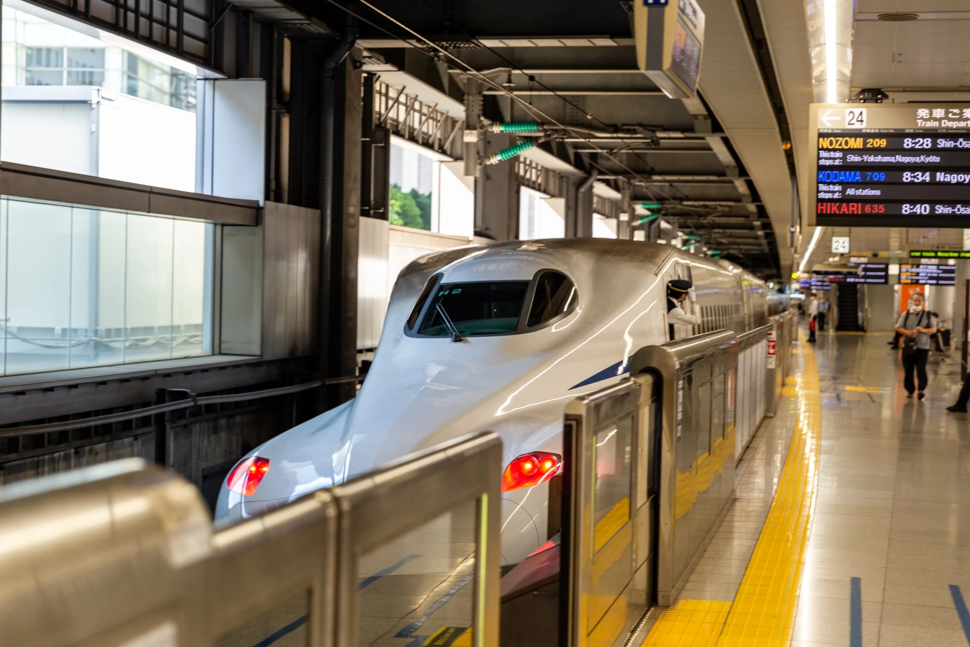 Shinkansen train stopped at Shinagawa Station platform in Tokyo