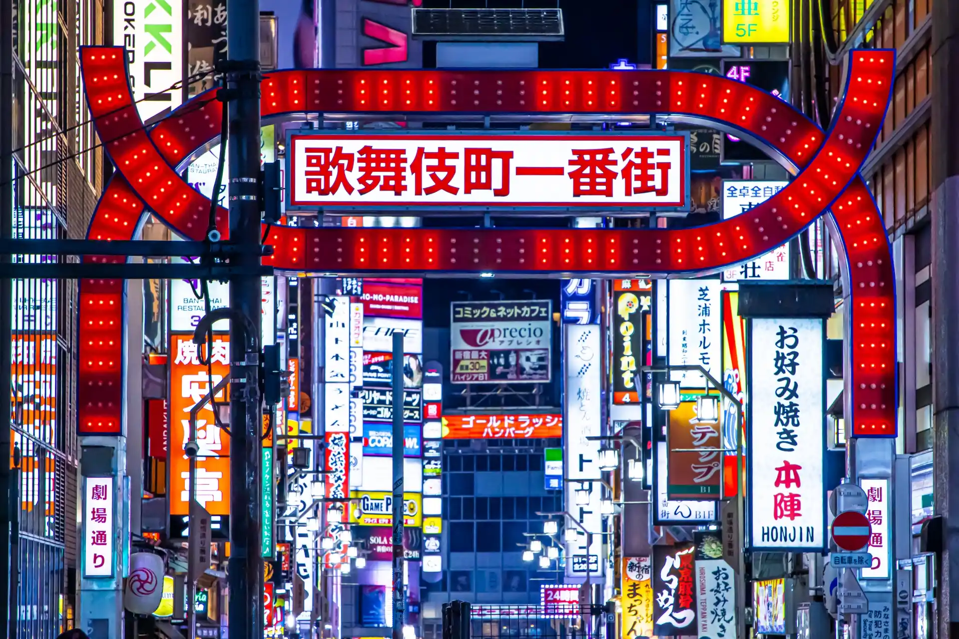 Famous Kabukicho gate in Shinjuku, Tokyo, surrounded by nightlife neon signage