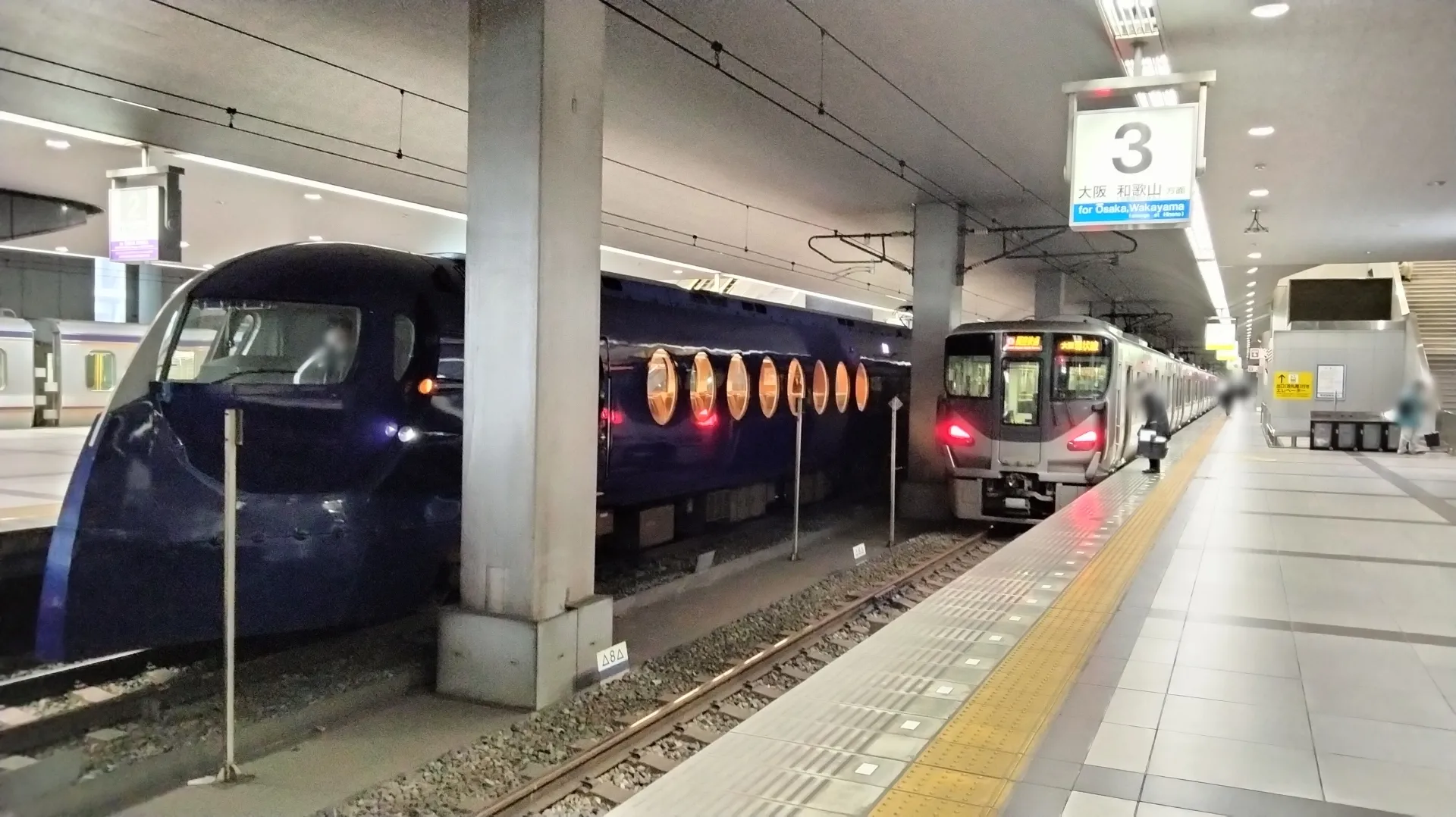 Nankai Rapi:t train and local airport line train at Kansai Airport Station platform