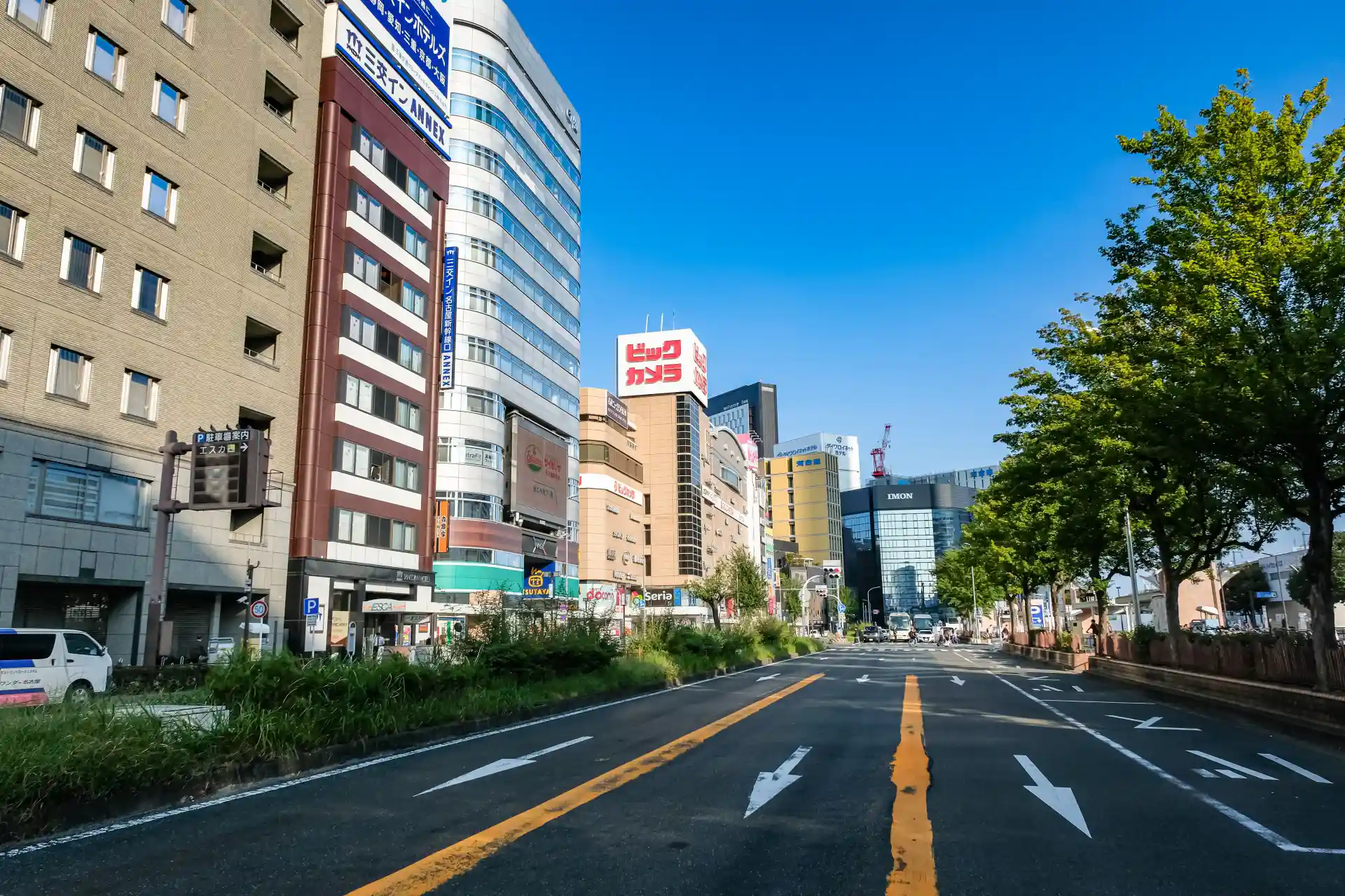 Street view near the Taiko Dori Exit of Nagoya Station with the Bic Camera building and surrounding shops on the west side
