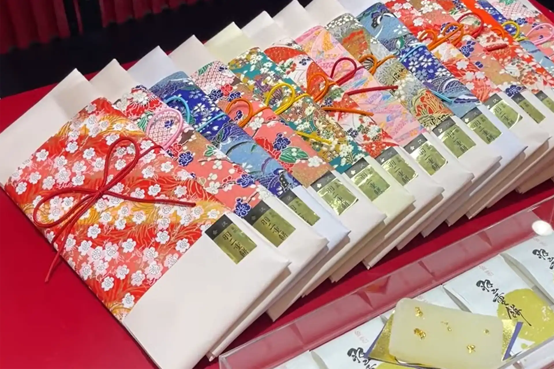 Kanazawa traditional sweets wrapped in colorful paper, featuring gold leaf mochi