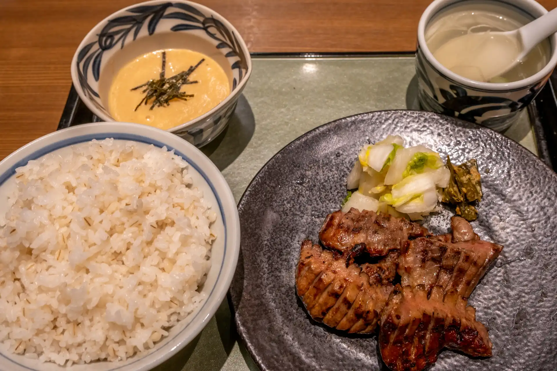 Traditional Sendai gyūtan set meal served with barley rice, soup, tororo, and oxtail soup