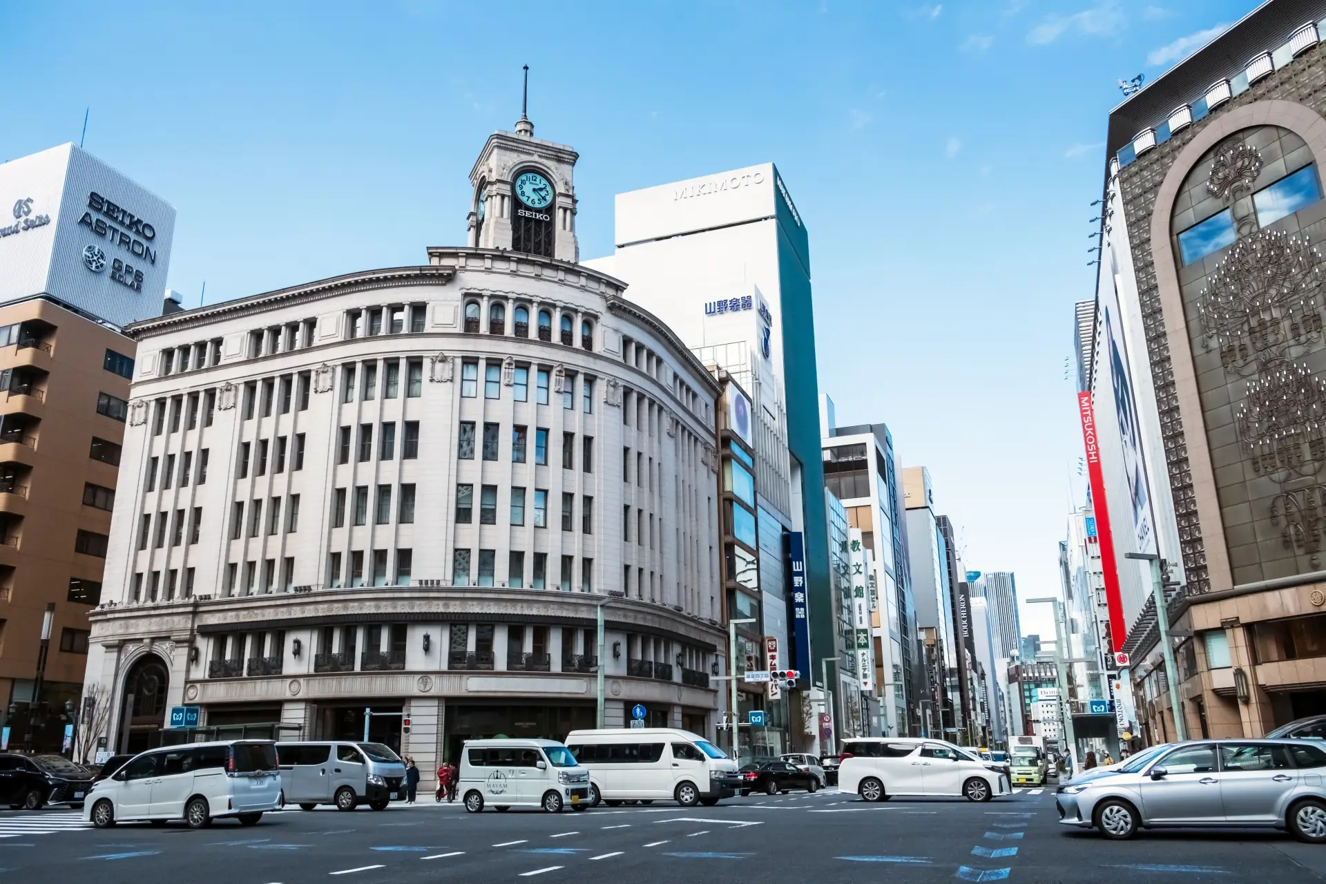 Iconic intersection in Tokyo's Ginza area featuring the Seiko clock tower