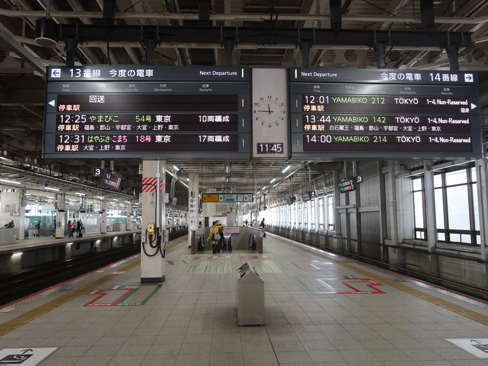 Sendai Station Shinkansen platform with departure boards showing train times and destinations for Tokyo-bound services.