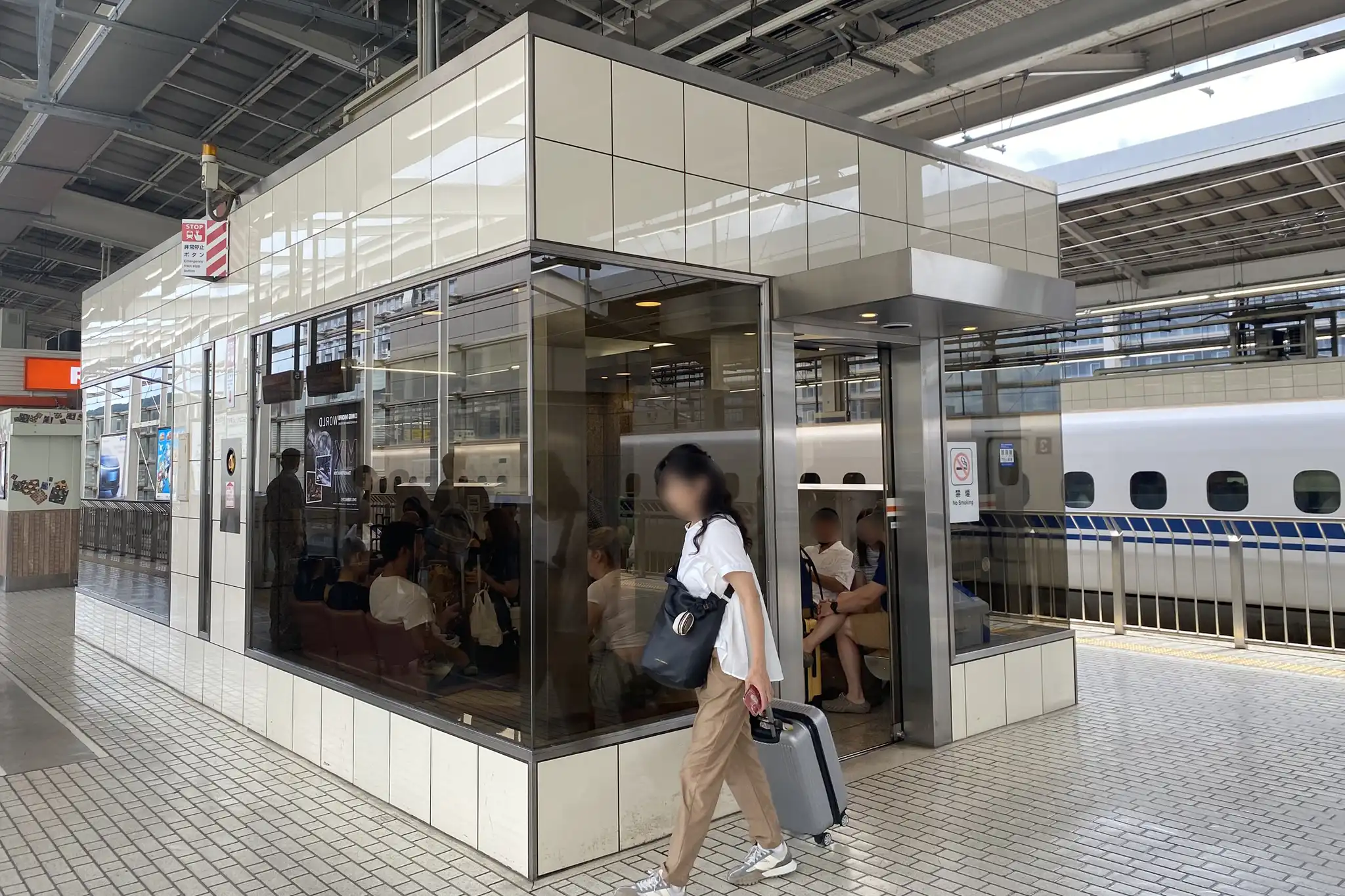 Rest area located on the Kyoto Station Shinkansen platform providing a seated indoor space for travelers