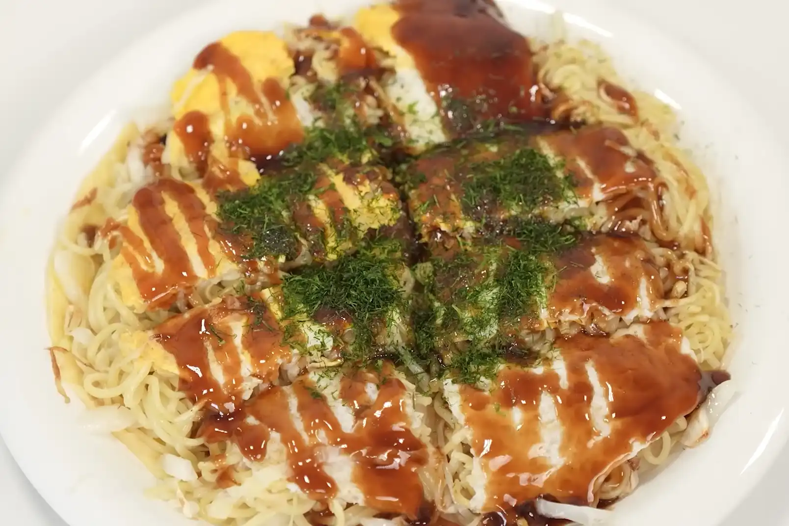Hiroshima-style okonomiyaki, a local favorite, available at restaurants in Hiroshima Station