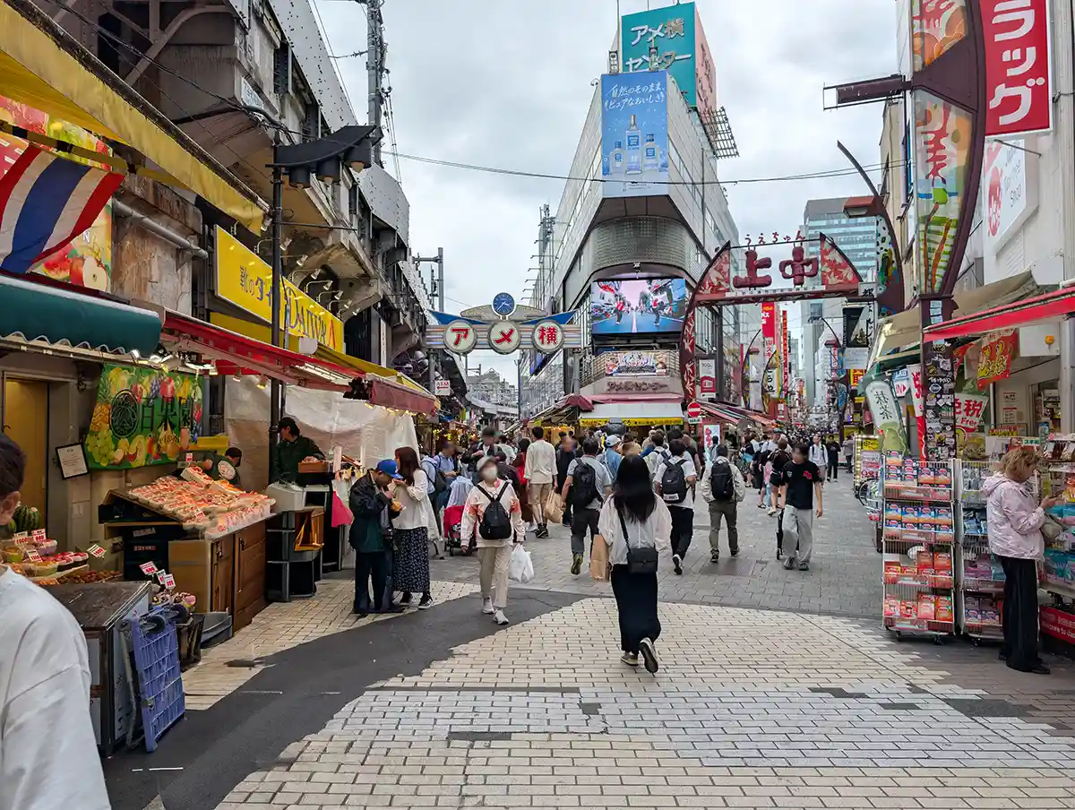 Ameyoko shopping street in Ueno with market stalls, souvenir shops, and many travelers