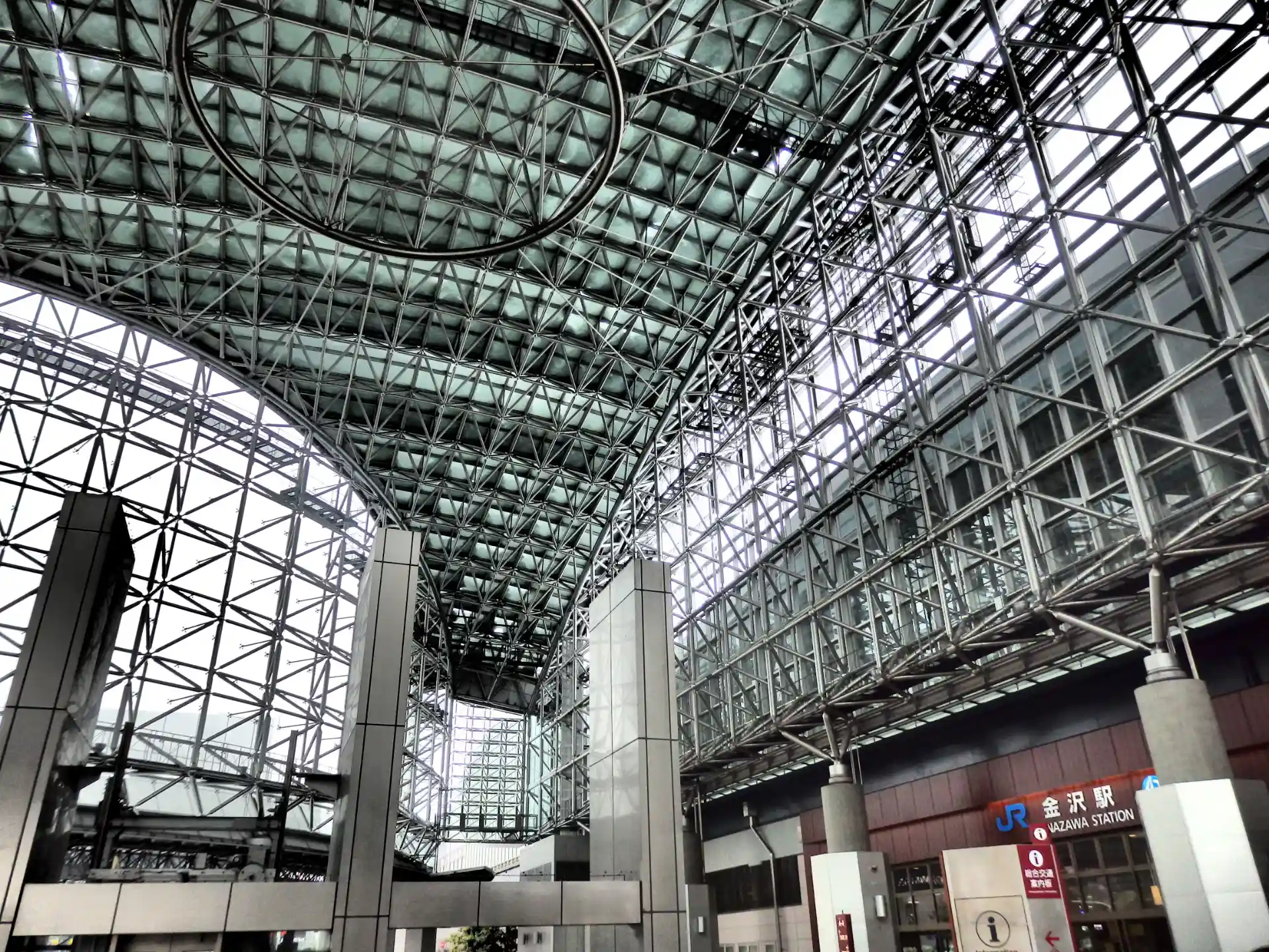 Interior view of Kanazawa Station Motenashi Dome with its modern glass and steel architecture