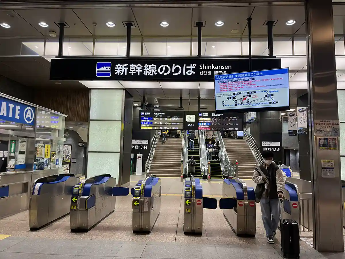 Shinkansen ticket gates at Kanazawa Station leading to platforms 11 to 14.