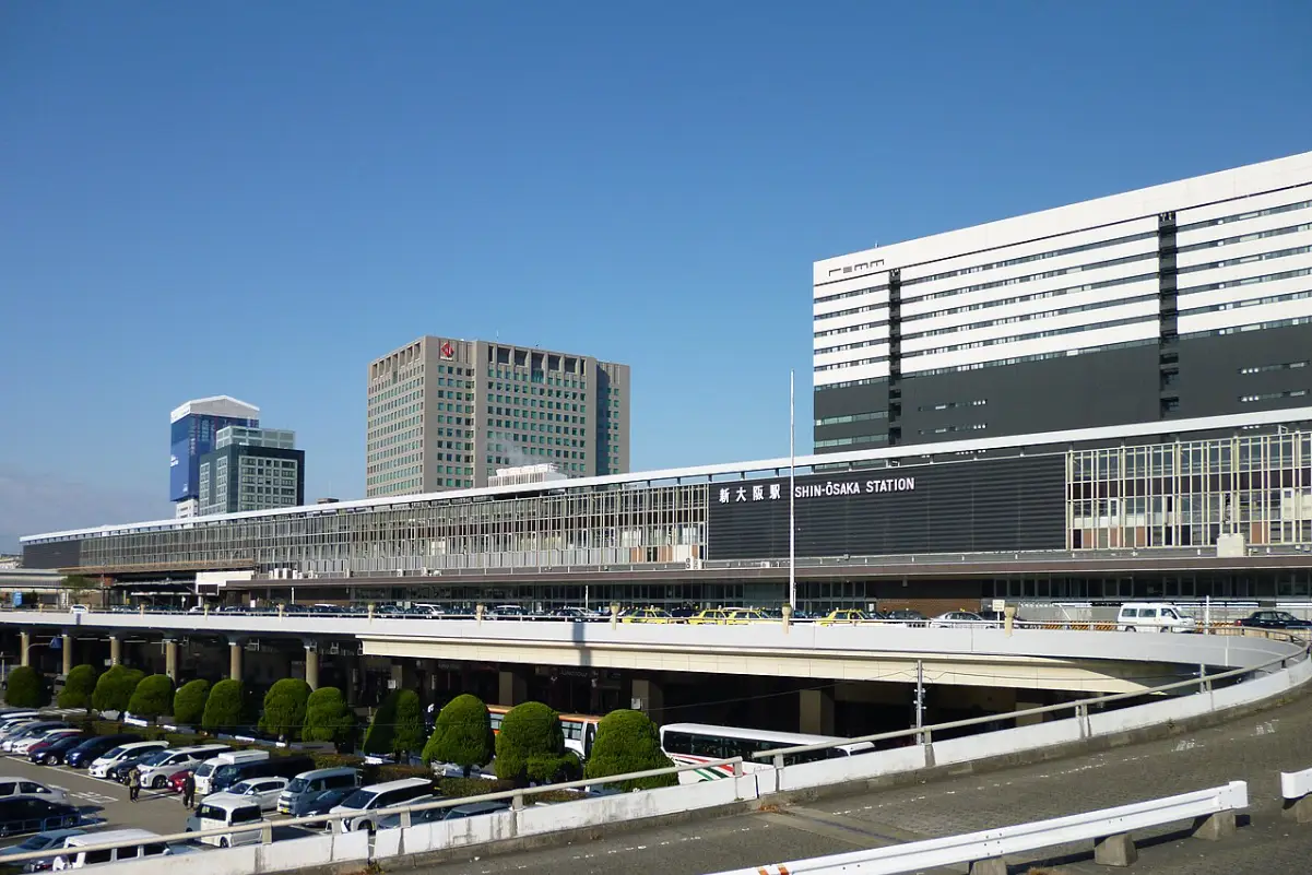 View of Shin-Osaka Station complex including Shinkansen tracks and city buildings
