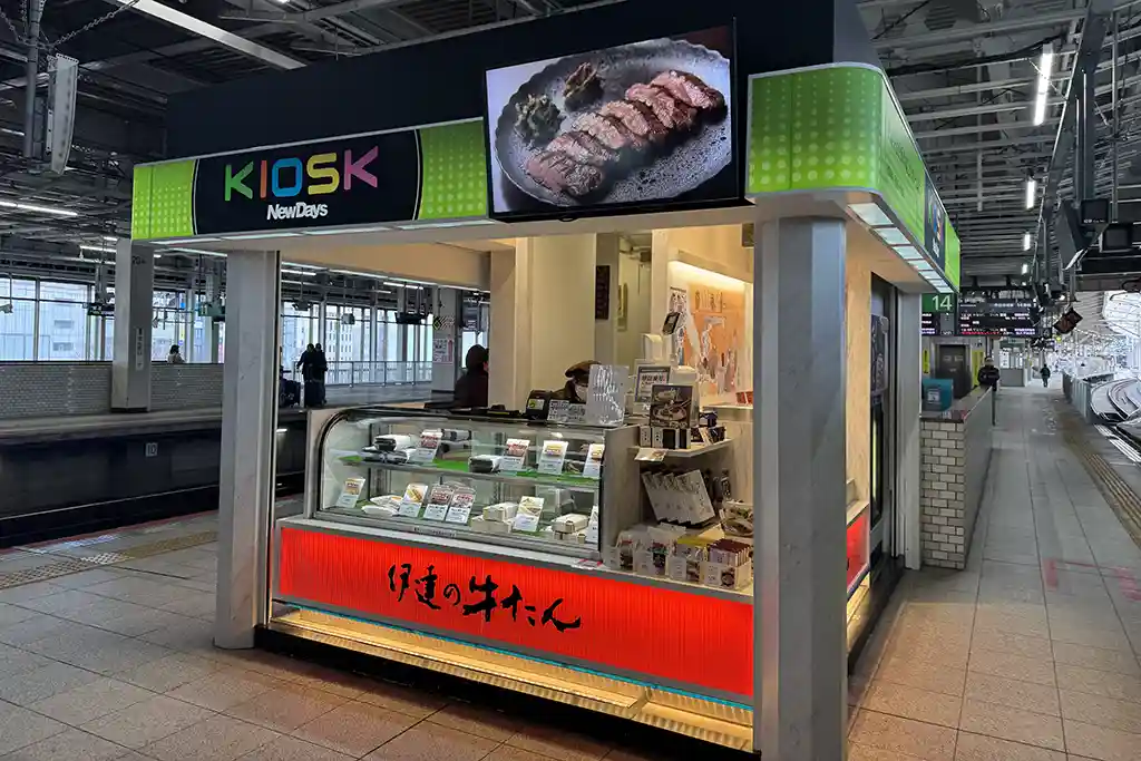 Convenience kiosk on the Sendai Station Shinkansen platform providing ekiben and snacks for travelers.