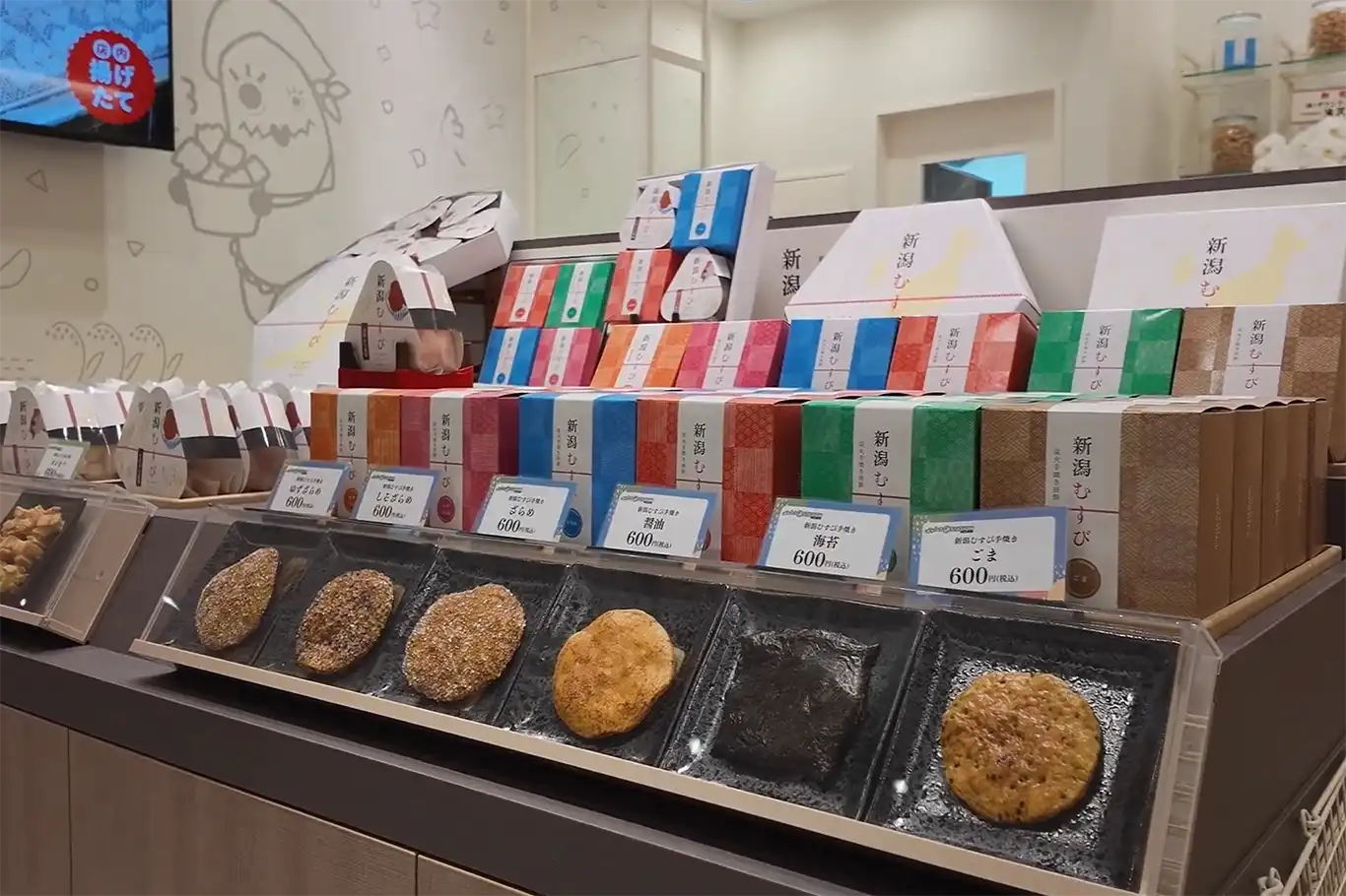 Variety of Niigata rice crackers sold at a senbei shop in Niigata Station, popular as travel souvenirs