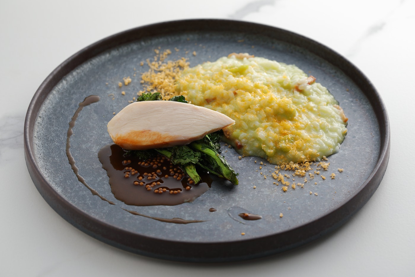 Broad bean and mimolette risotto with pickled mustard greens and Kyoto red chicken bollito