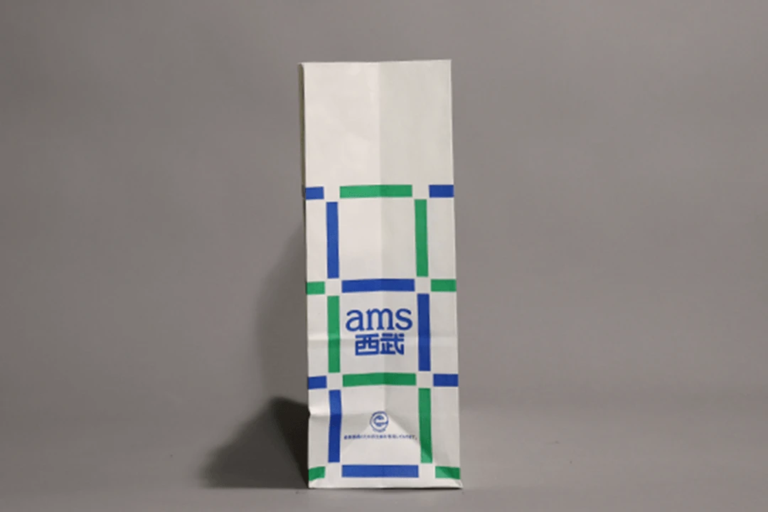 マチにはams西武のロゴタイプ ロゴタイプと紙袋はどちらも田中一光によるデザイン