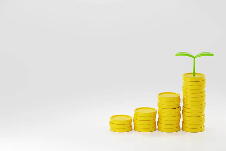 コインに芽が生えているイメージ画像