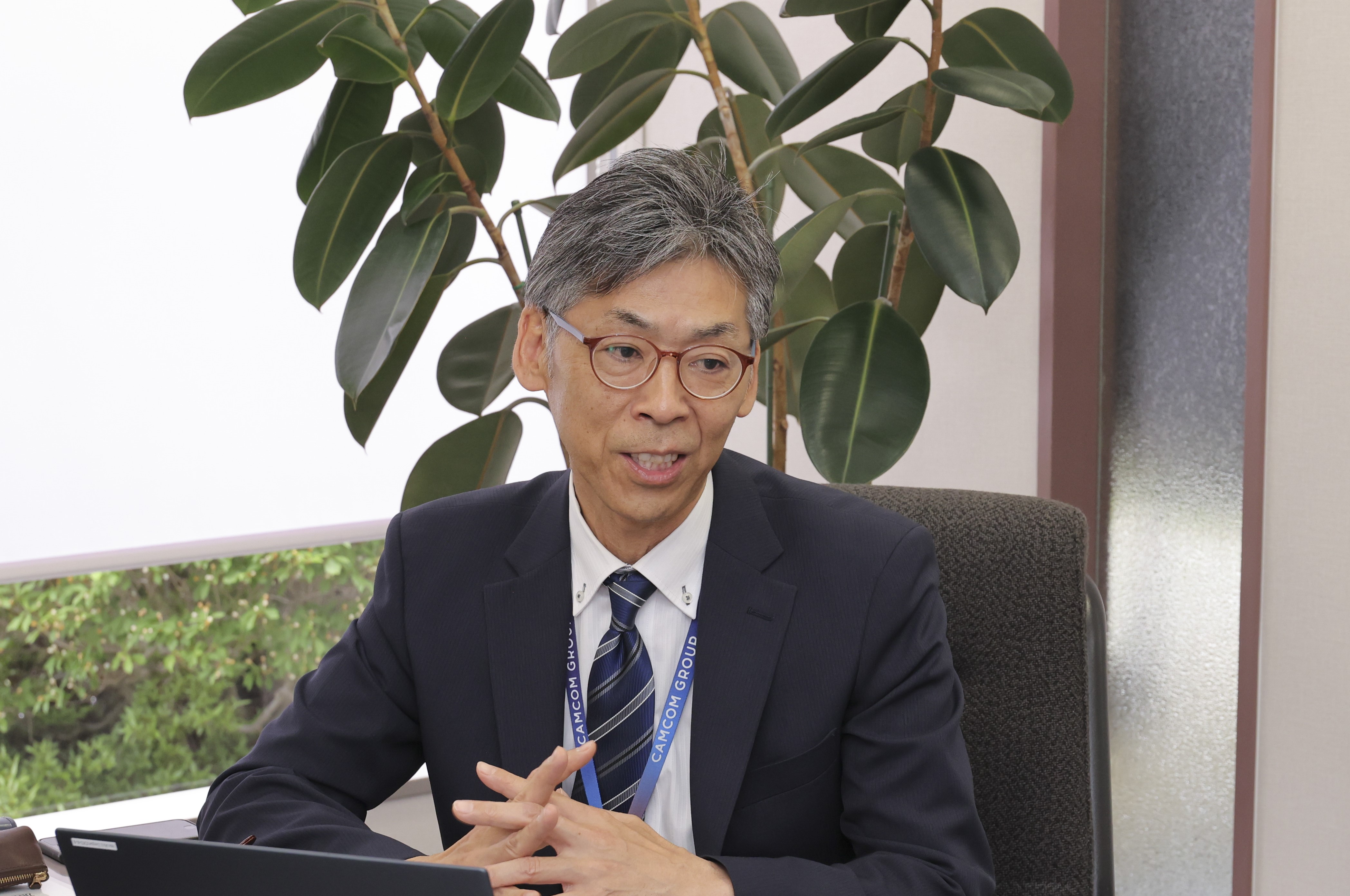 ARM推進部SIPS マネージャーの木村 秀一 様がインタビューでお話をしている画像 