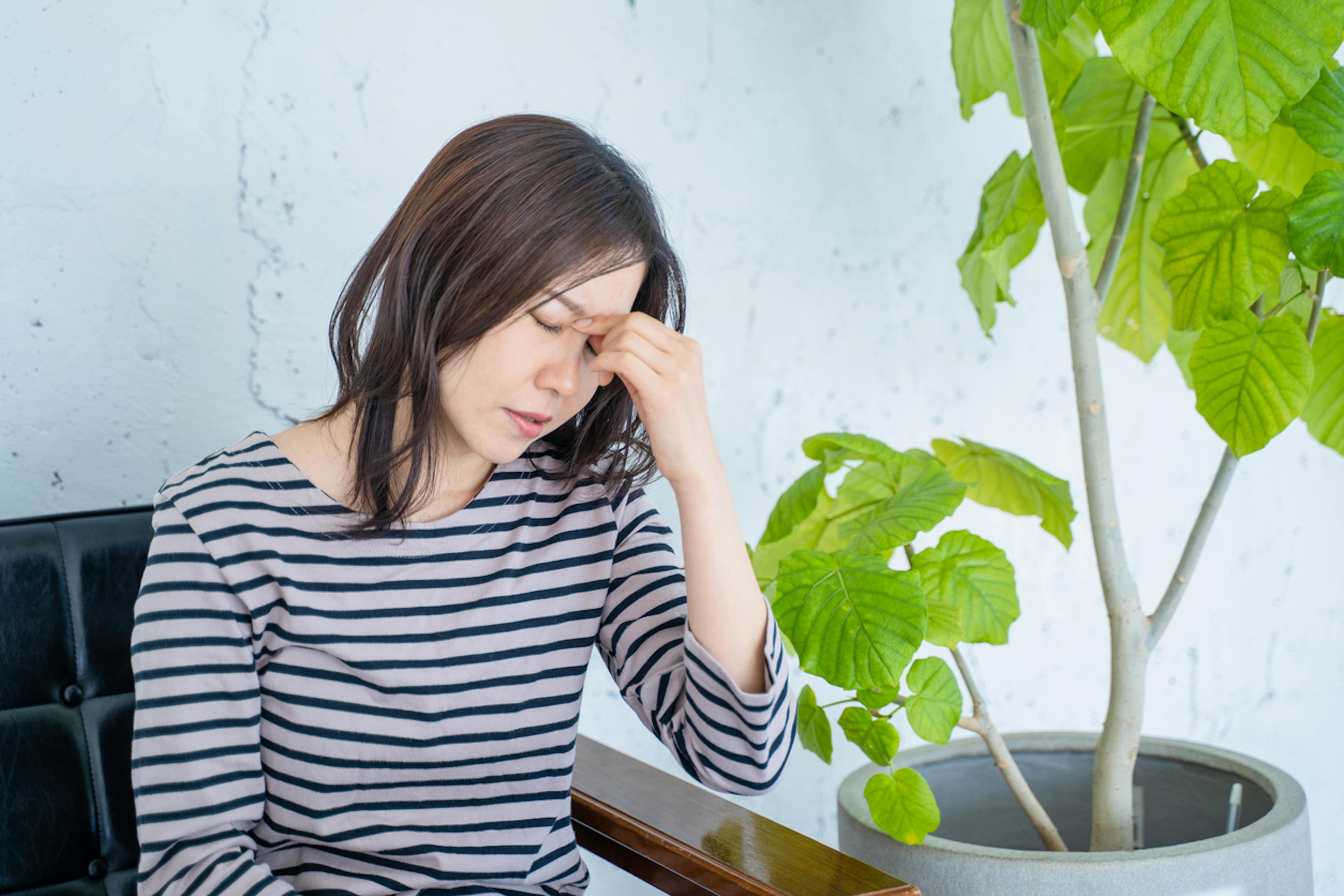 体調の悪そうな女性