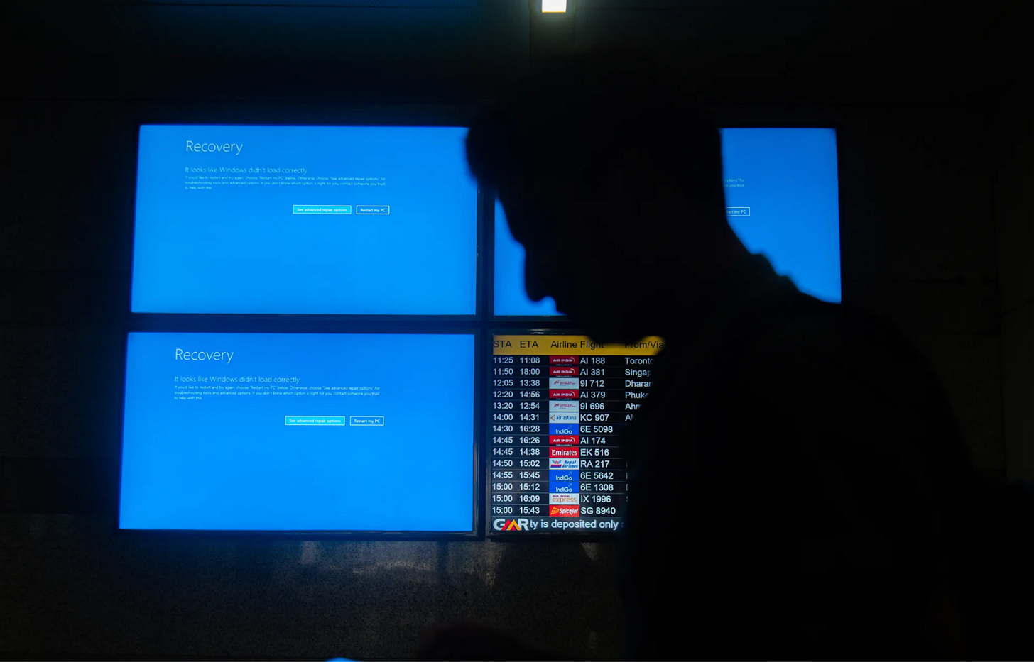 Blue Screens of Death in Indira Gandhi International Airport. Photo by Kabir Jhangiani / NurPhoto via Getty Image