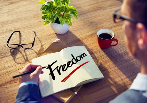Man with Note Pad and Freedom Concept