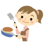 料理をする保育士
