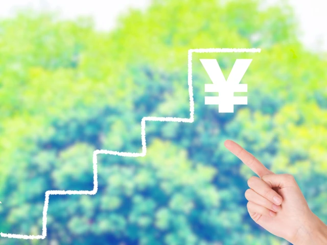 円マークと指さす手