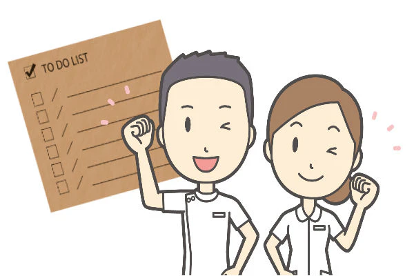 ガッツポーズをしてウィンクする理学療法士