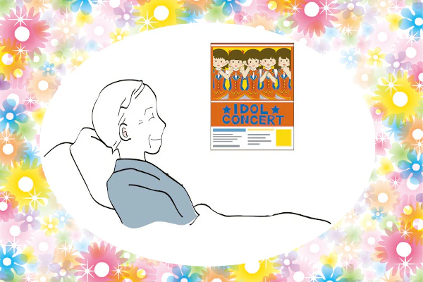 患者さんが病室のポスターを見ている