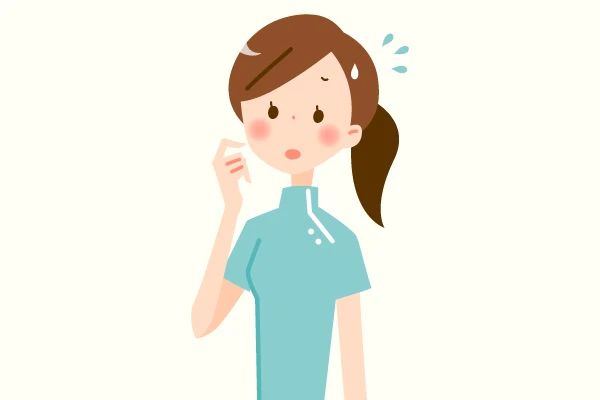 不安な表情の看護師