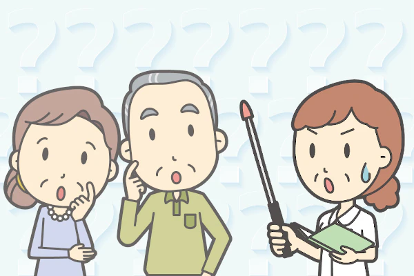 看護師が患者家族に説明している