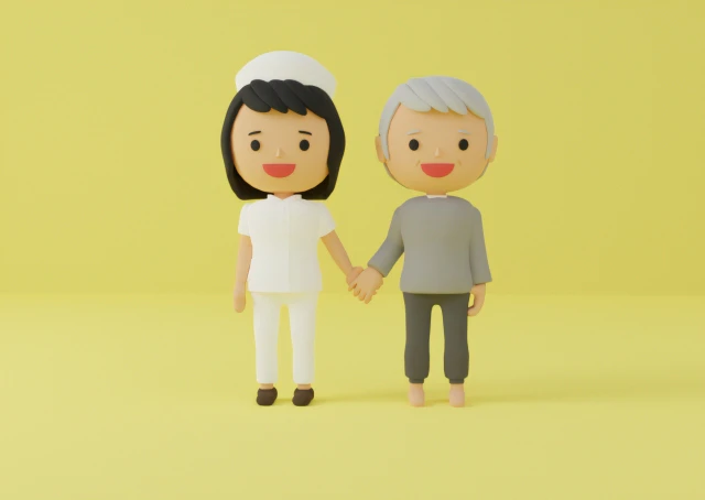 手をつなぐ看護師さんと年配の人の人形