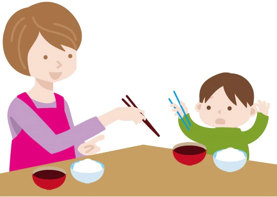 子どもと一緒に食事をするお母さん