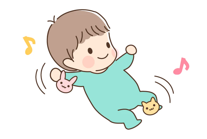 手足にラトルを付けて遊ぶ赤ちゃん