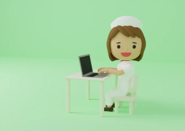 パソコンを打つ看護師さんの人形