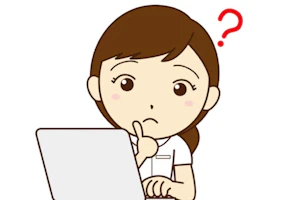 パソコンを見ている看護師