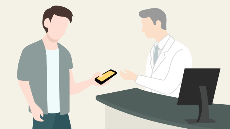 チェックシートの結果を薬剤師に提示し、指導を受ける男性のイメージ