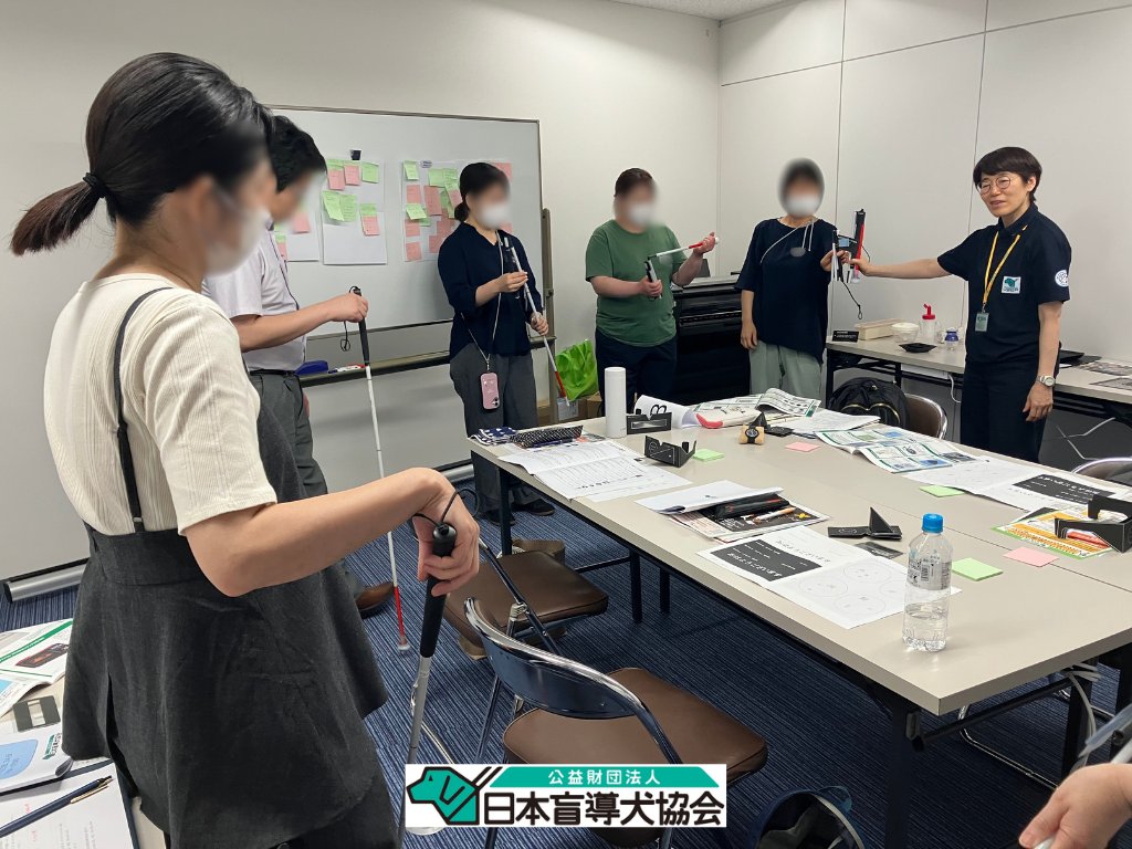 Workshop participants trying out long canes