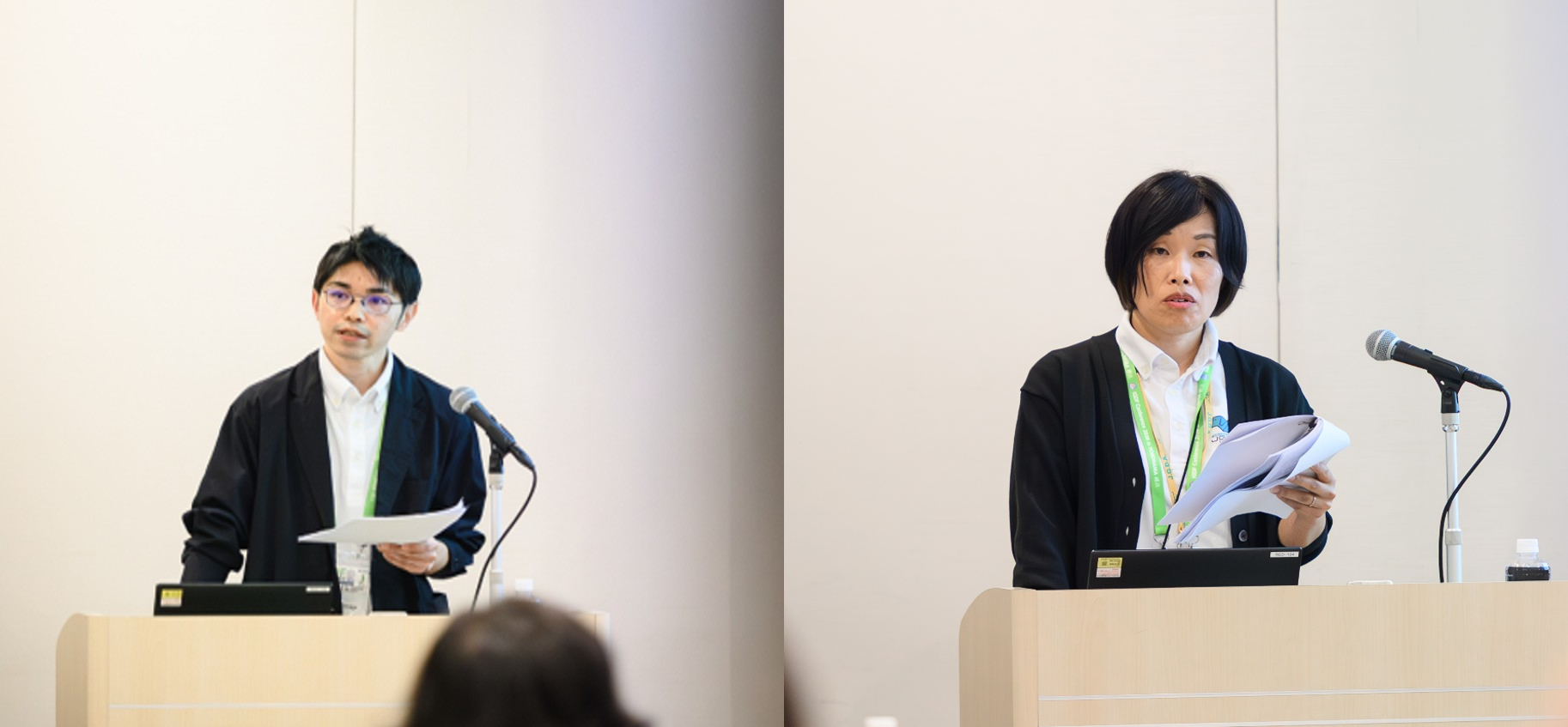 Picture of Yosuke Suenaga and Tomoko Takahashi from Japan Guide Dog Association at the podium 