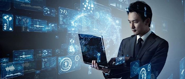 パソコンでAIを利用するビジネスマンのイメージ