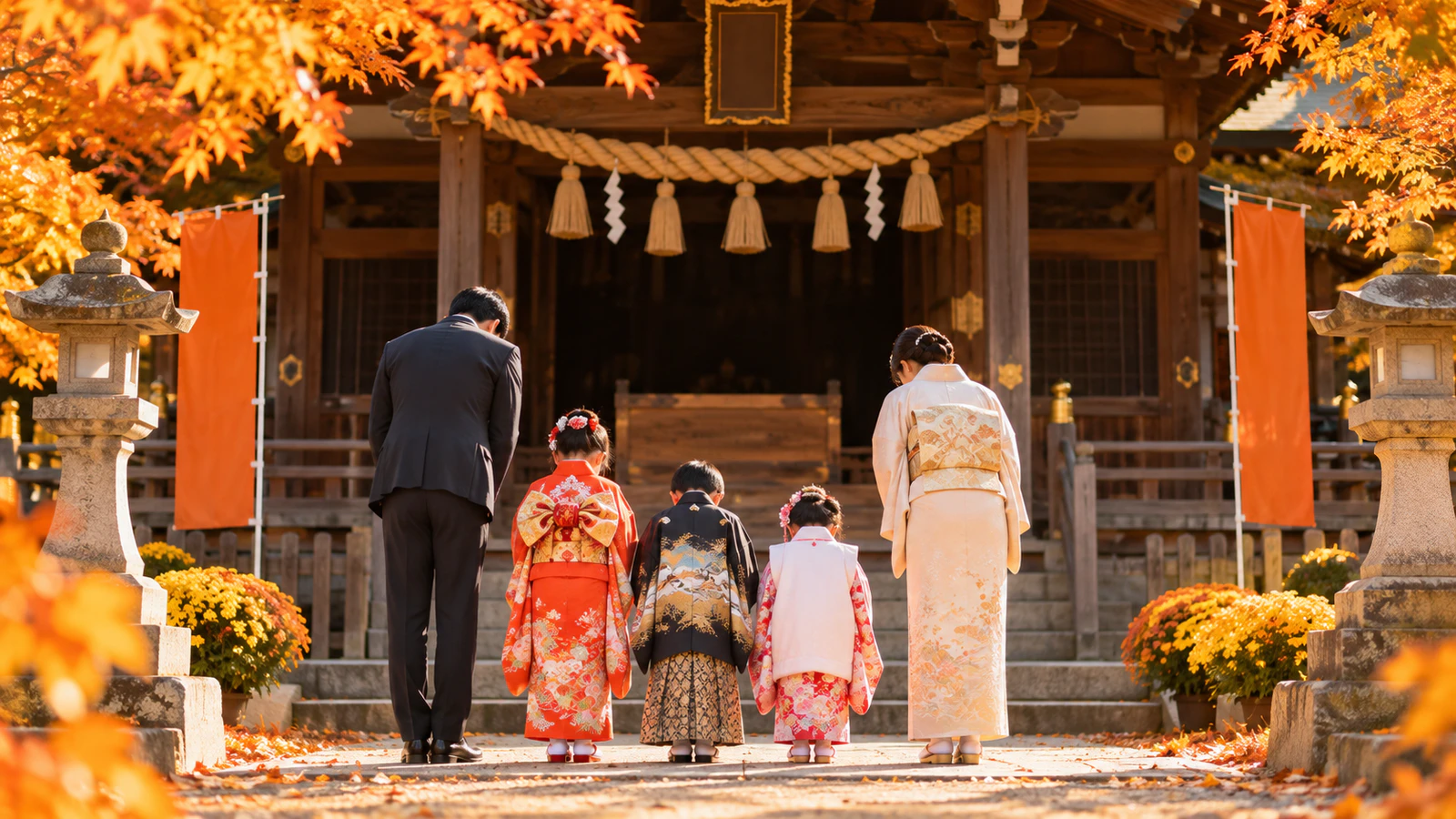 秋の神社の拝殿の前で、晴れ着の子どもと両親がそろっておじぎをしてお参りする様子