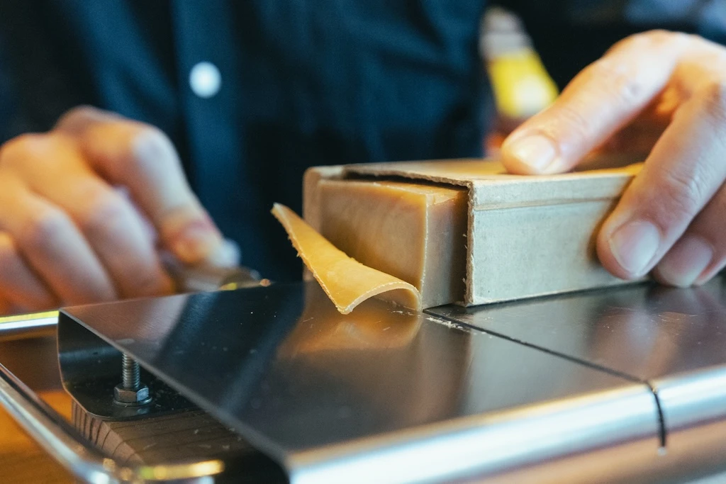 Close-up of slicing solid soap.