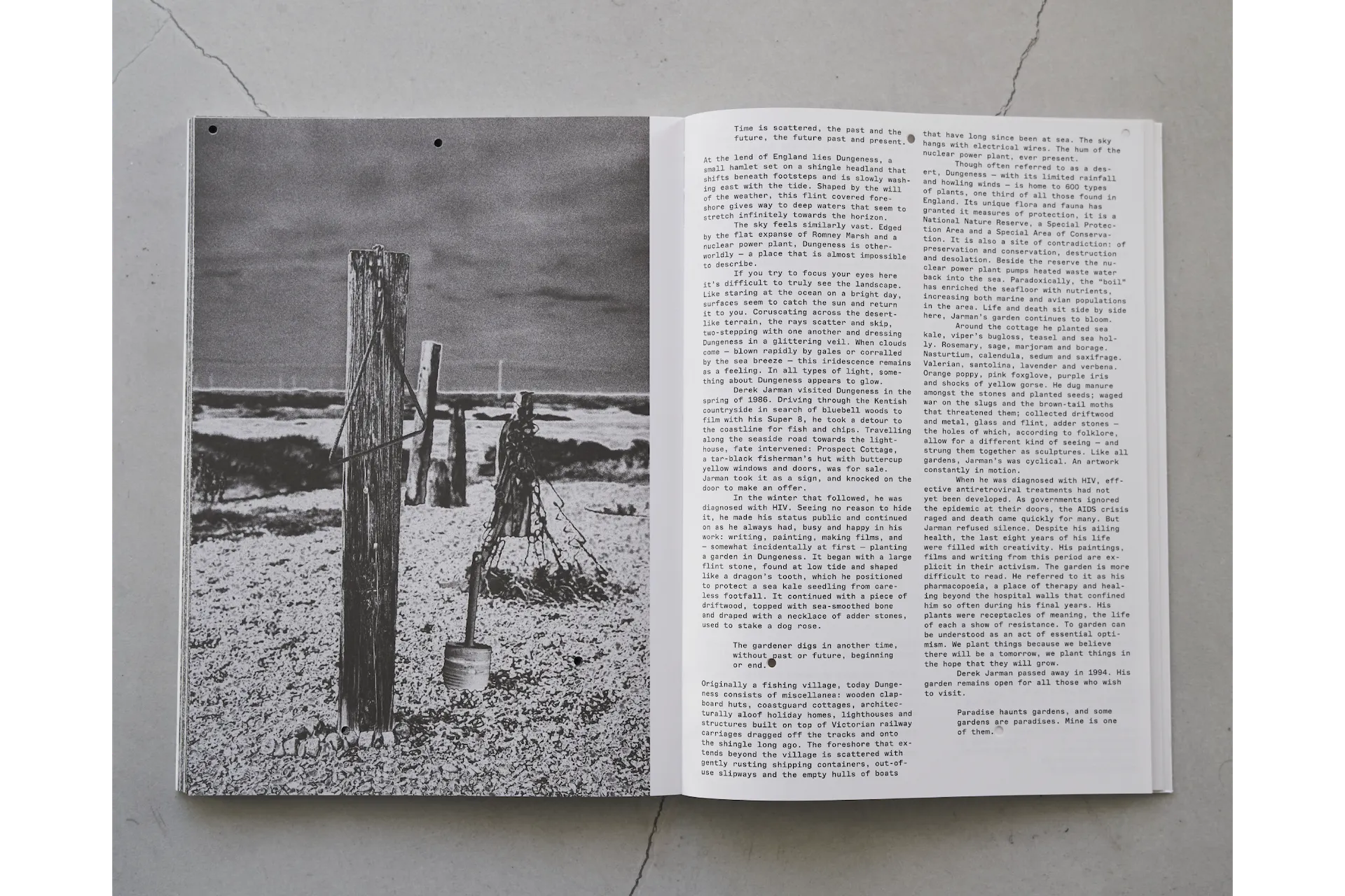 A photo of a spread from “Samsara.” On the left page is a monochrome photograph, and on the right is text in English. A photo and text about the yard where Derek Jarman spent his later years.