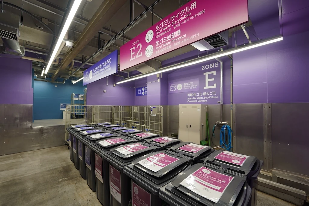 Photo of the building's refuse collection area. The walls and signs have been repainted to maintain a clean image.