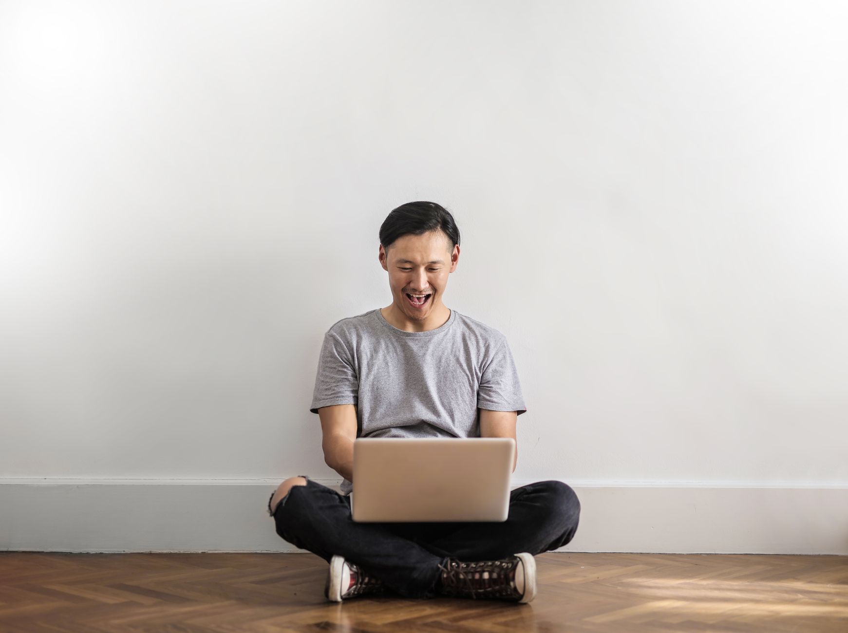 person using laptop happy
