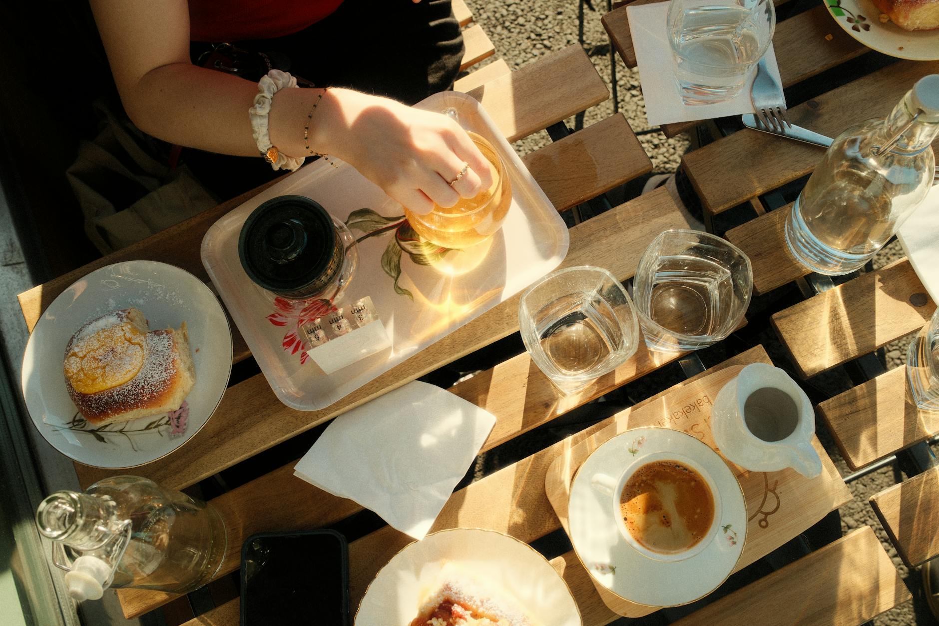 woman reading magazine cafe