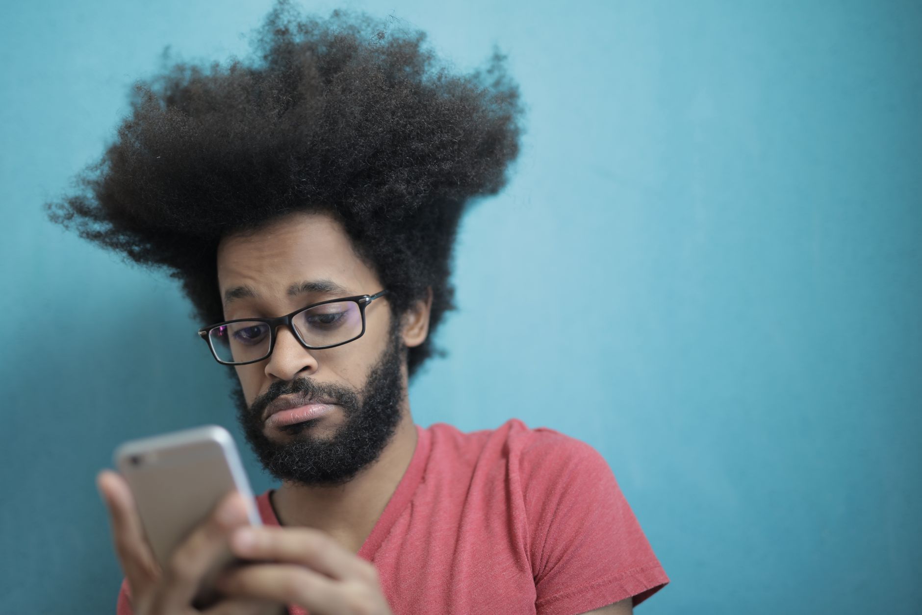 person confused smartphone subscription